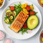 Top Zepbound Meal Plan Recipes People Love for Real Results 3 A 1:1 image of grilled salmon with arugula, avocado, and pink salt, representing clean and balanced Zepbound meal plan recipes